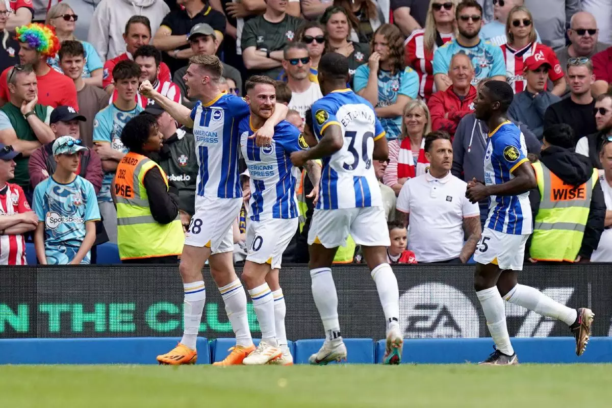 Brighton and Hove Albion’s Evan Ferguson (left) celebrates with teammates after scoring