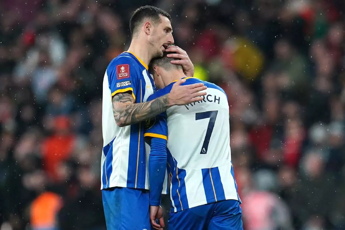 Brighton's Lewis Dunk comforts Solly March