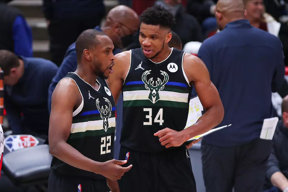 Milwaukee Bucks forward Khris Middleton (22) and Milwaukee Bucks forward Giannis Antetokounmpo (34)