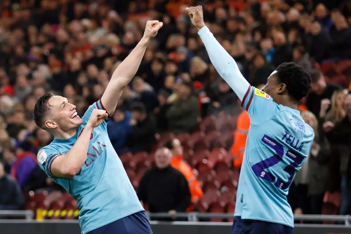 Burnley's Connor Roberts celebrates scoring their side's second goal of the game with team-mate Nathan Tella