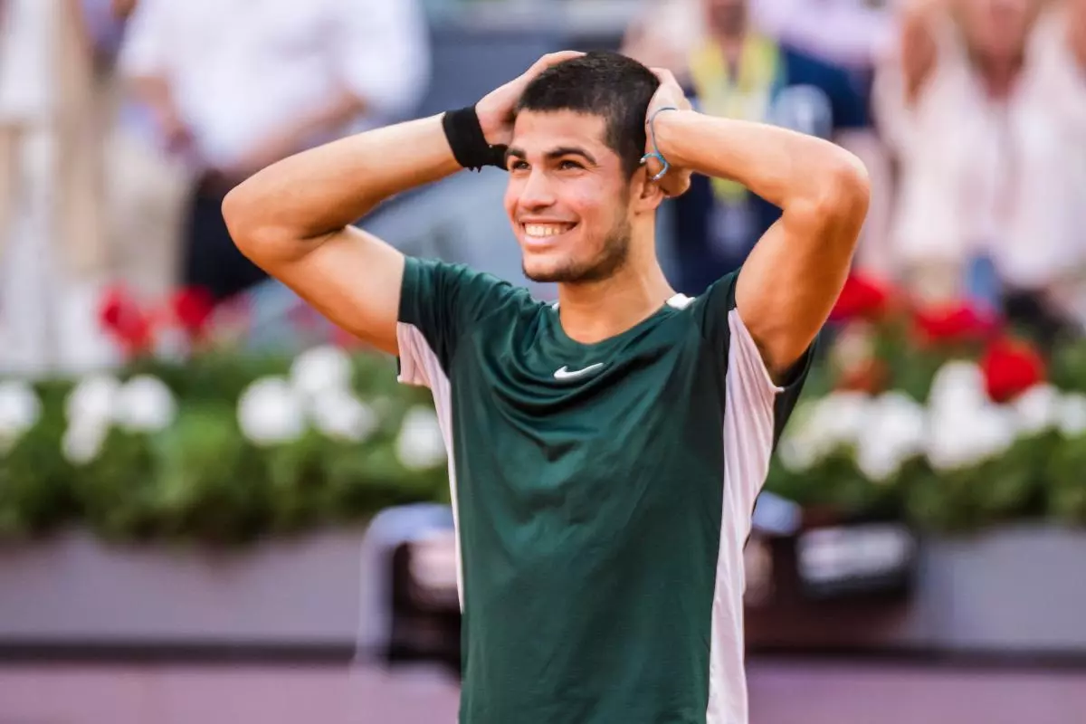 Carlos Alcaraz celebrates vs Novak Djokovic