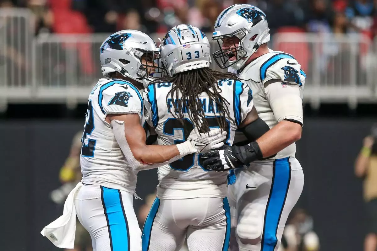 Carolina Panthers running back D'Onta Foreman is congratulated by teammates after scoring a touhdown