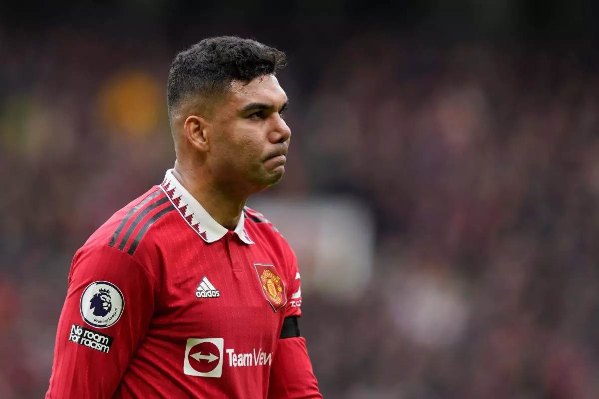 Casemiro of Manchester United walks off the pitch dejected after getting a red card - MArch 2023