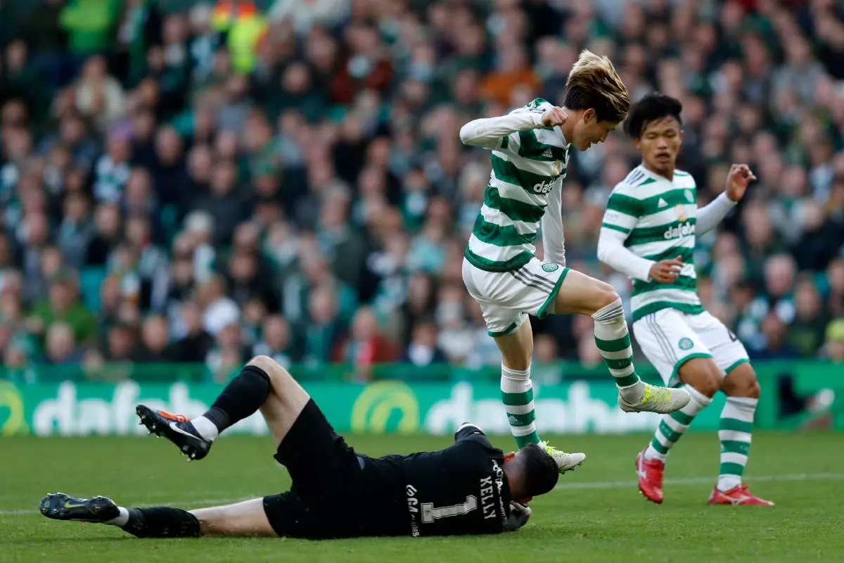 Celtic's Kyogo Furuhashi and Motherwell's Liam Kelly in action during the cinch Premiership match at Celtic Park