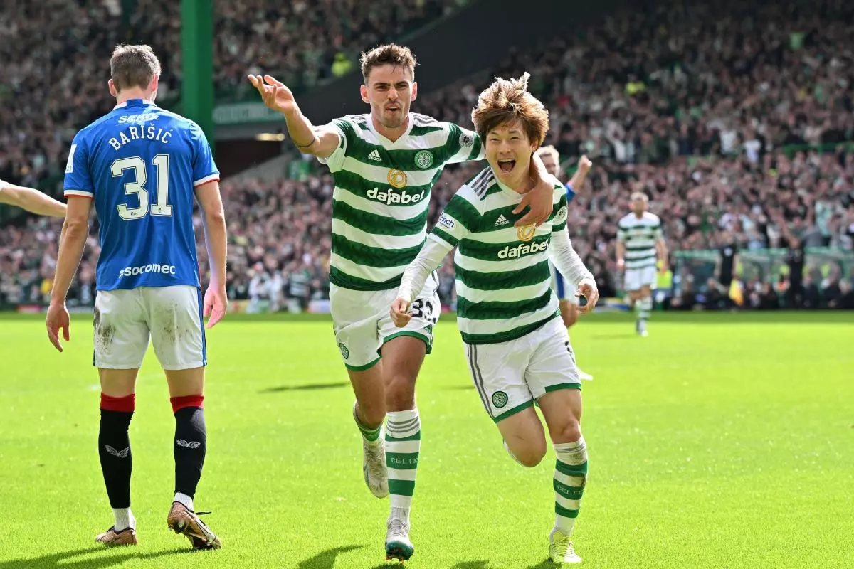 Celtic's Kyogo Furuhashi (right) celebrates scoring their side's second goal of the game during the cinch Premiership match at Celtic Park