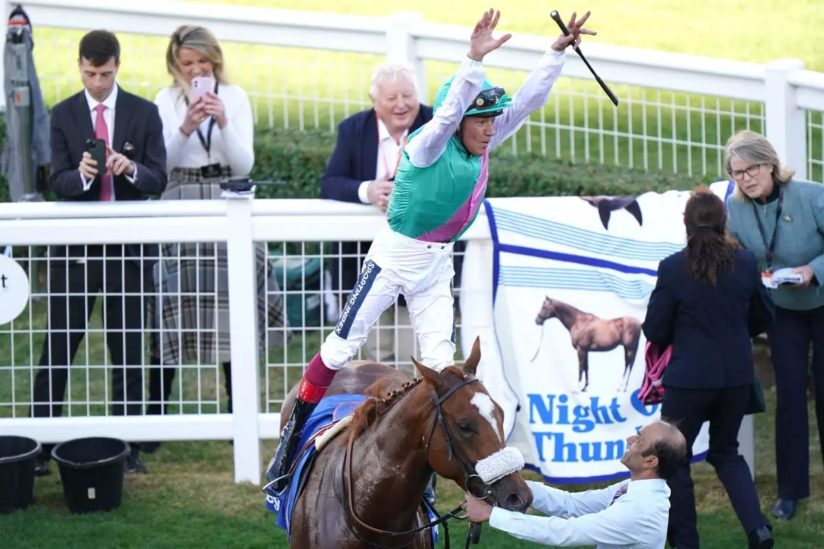 Chaldean and Frankie Dettori after winning Dewhurst Stakes