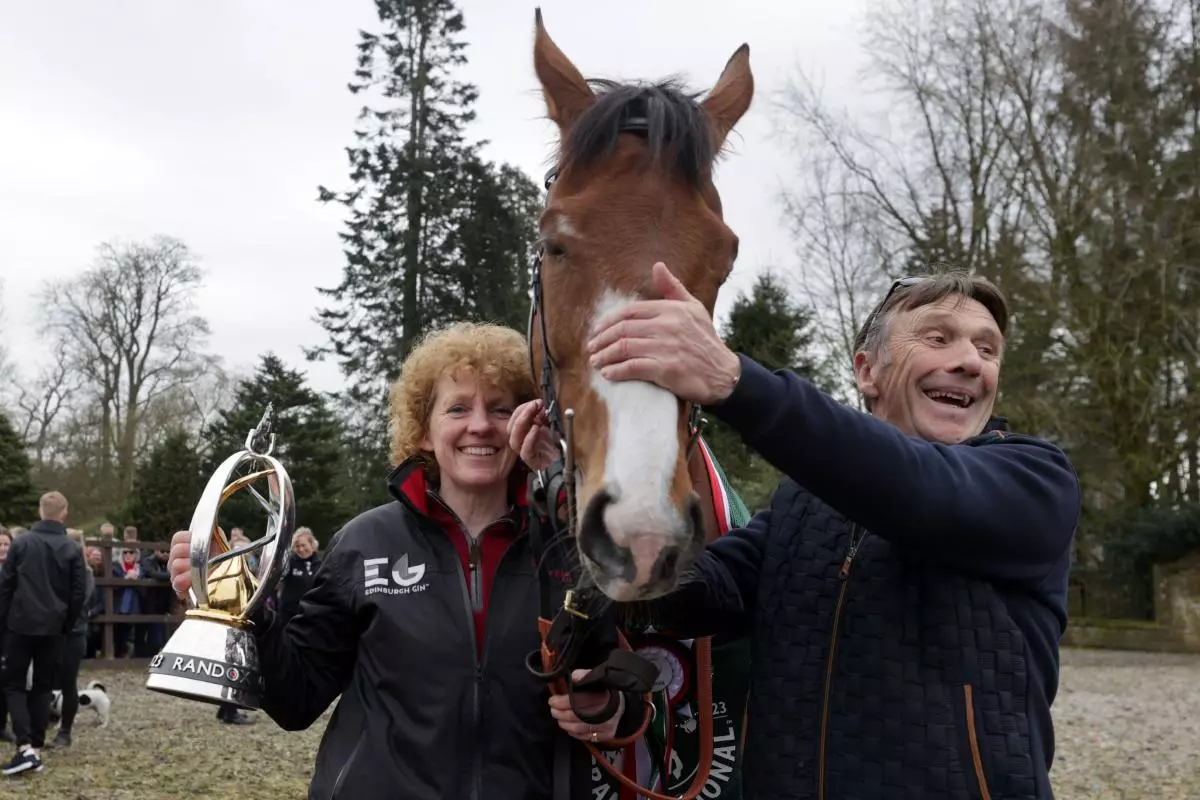 Corach Rambler with trainer Lucinda Russell (left) and Peter Scudamore during the Randox Grand National - May 2023