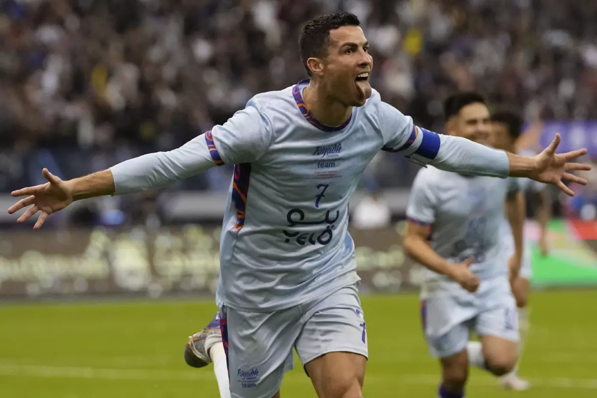 Cristiano Ronaldo celebrates after scoring his side's second goal playing for a combined Riyadh All Star XI