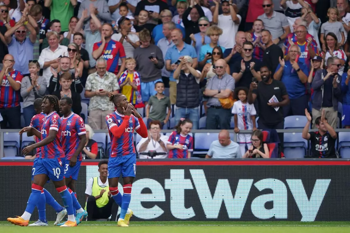 Crystal Palace's Wilfried Zaha (right) celebrates scoring