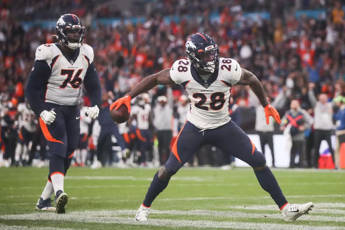 Denver Broncos' Latavius Murray celebrates after scoring a touchdown during the NFL International match at Wembley Stadium