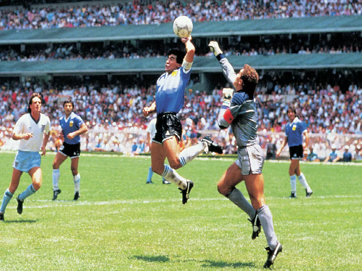 Diego Maradona, Argentina, scoring the legendary "Hand of God" goal during the England - Argentina (1-2) quarter-final match at the 1990 FIFA World Cup in Mexico.