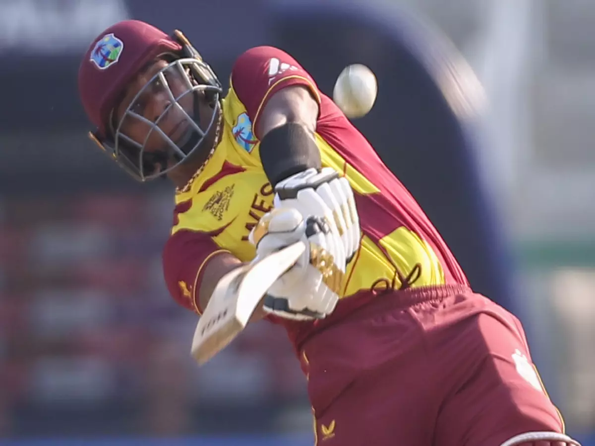 Dwayne Bravo of West Indies hits a shot and is caught out