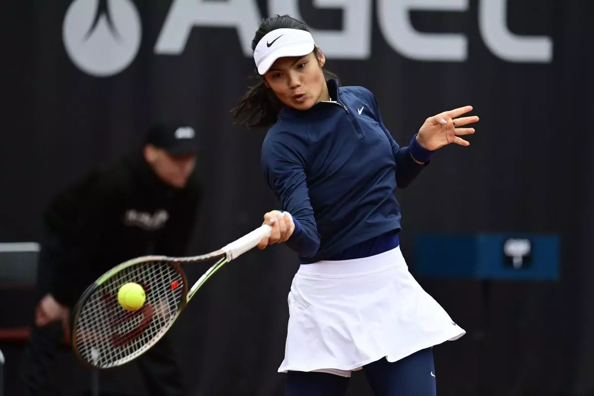 Emma Raducanu of Britain returns a ball