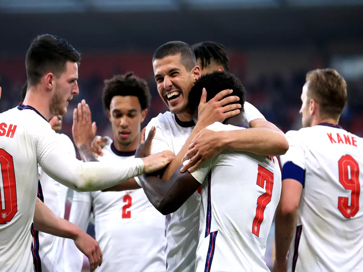 England's Bukayo Saka celebrates with team-mate Conor Coady after scoring their side's first goal of the game during the International Friendly at The Riverside Stadium, Middlesbrough.