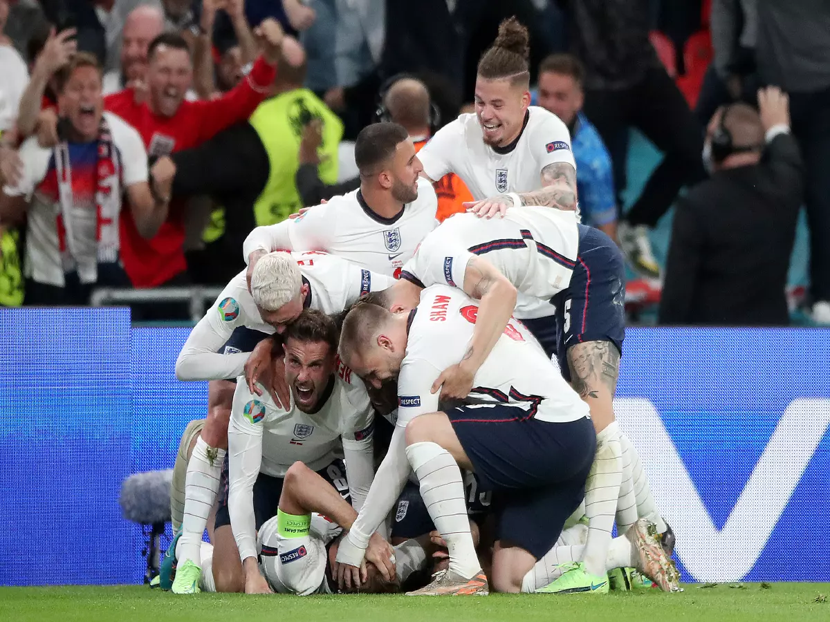 England's Harry Kane is mobbed by team-mates after scoring their side's second goal of the game in extra-time during the UEFA Euro 2020 semi final match at Wembley Stadium, London