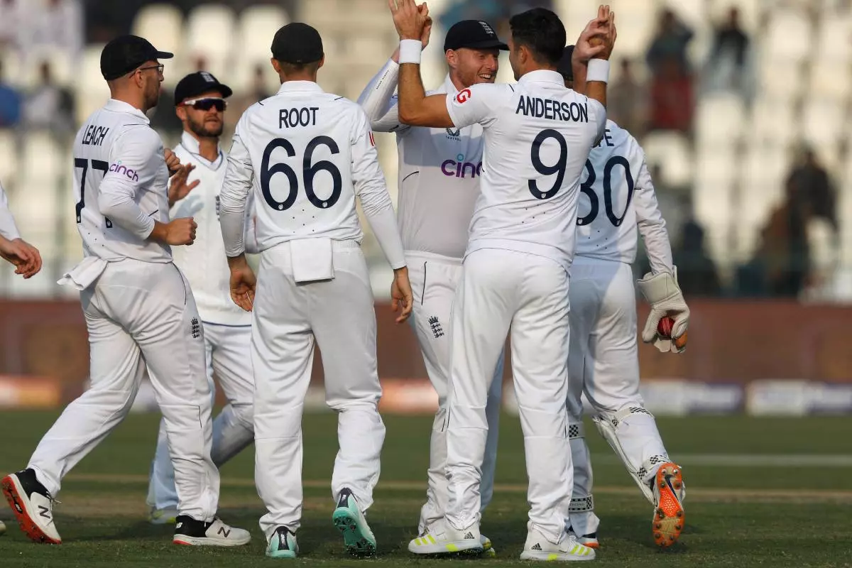England's James Anderson celebrates with his captain Ben Stokes after taking the wicket of Pakistan's Imam-ul-Haq