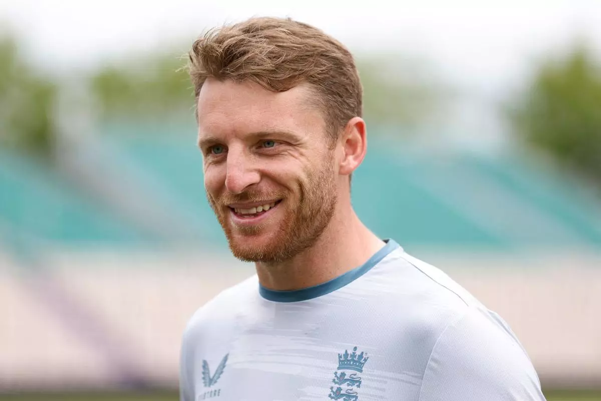 England's Jos Buttler talks to the media