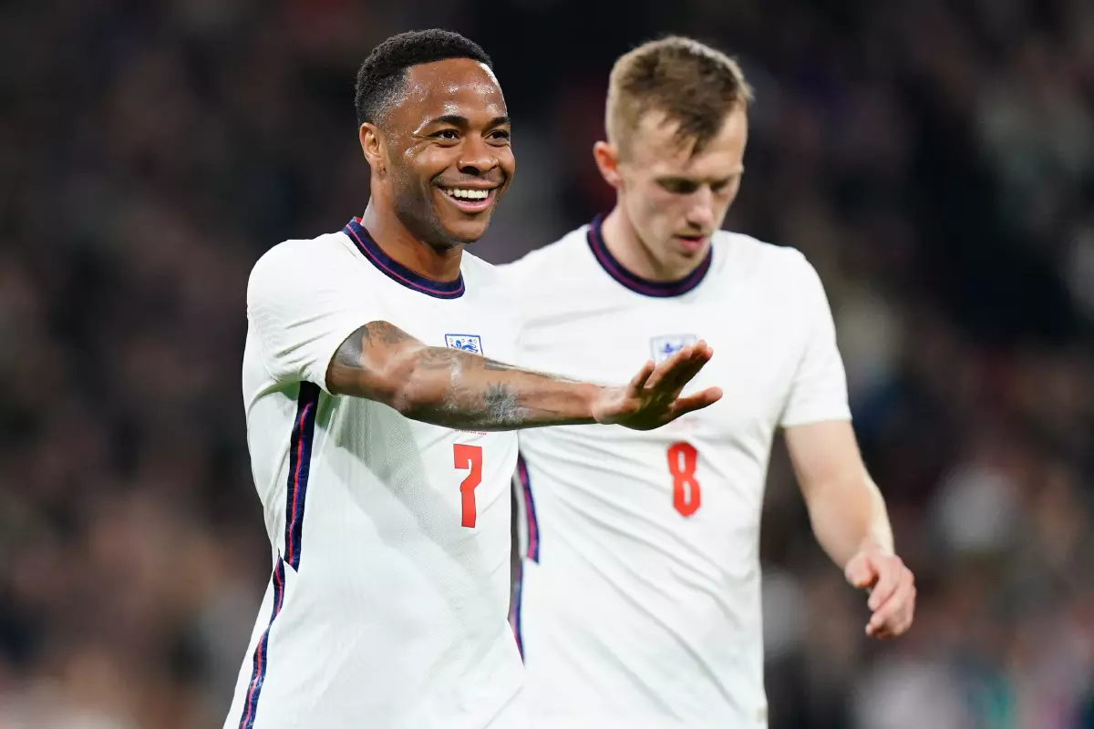 England's Raheem Sterling celebrates scoring their side's second goal of the game during the international friendly match at Wembley Stadium, London.