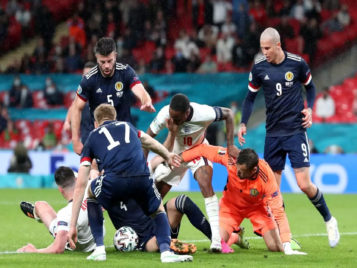 England and Scotland players tussle for ball at Wembley