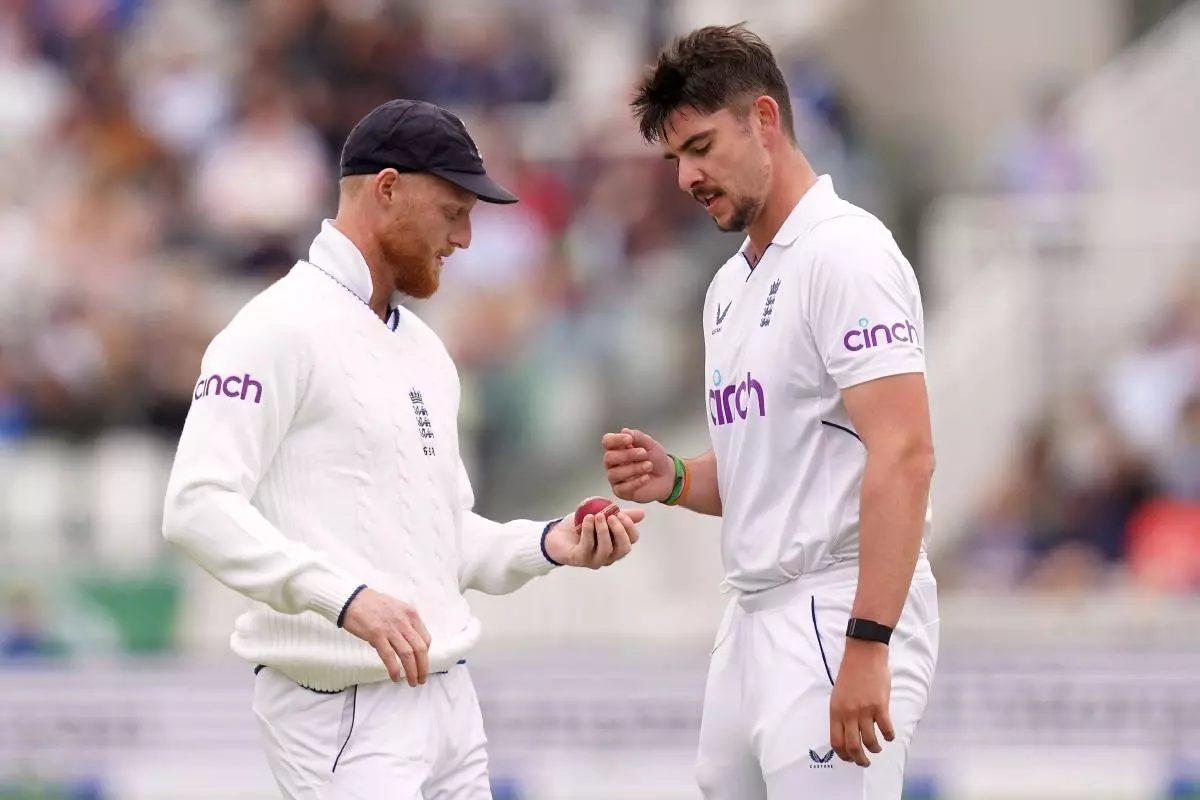 England's Ben Stokes with Josh Tongue