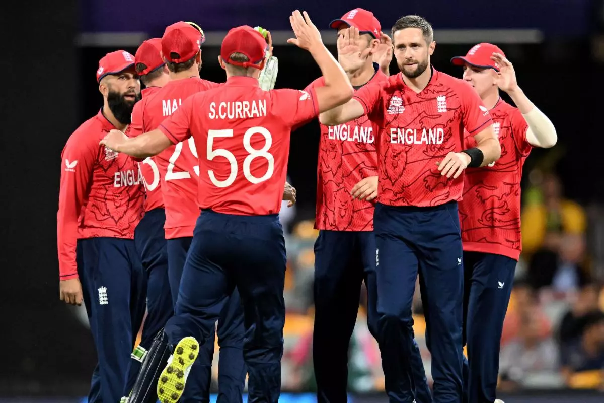 England's Chris Woakes celebrates with team mates