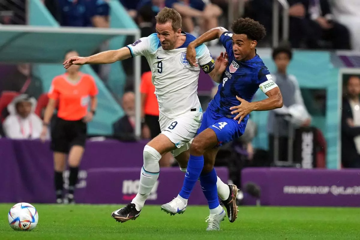 England's Harry Kane and USA's Tyler Adams battle for the ball