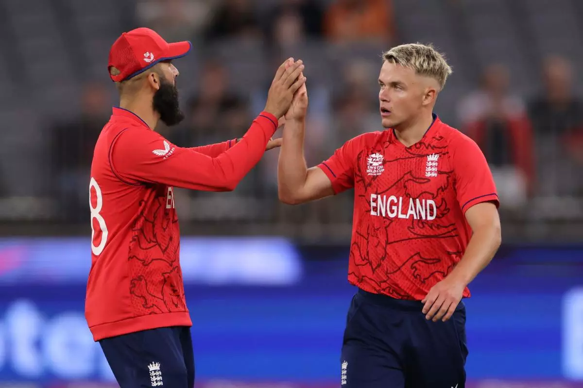 England's Moeen Ali celebrates with Sam Curran