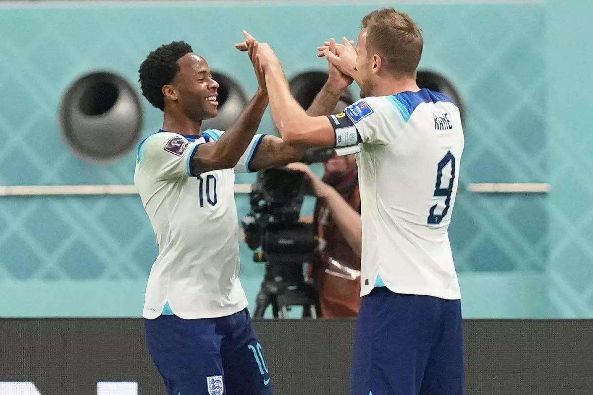 England's Raheem Sterling (left) celebrates with Harry Kane