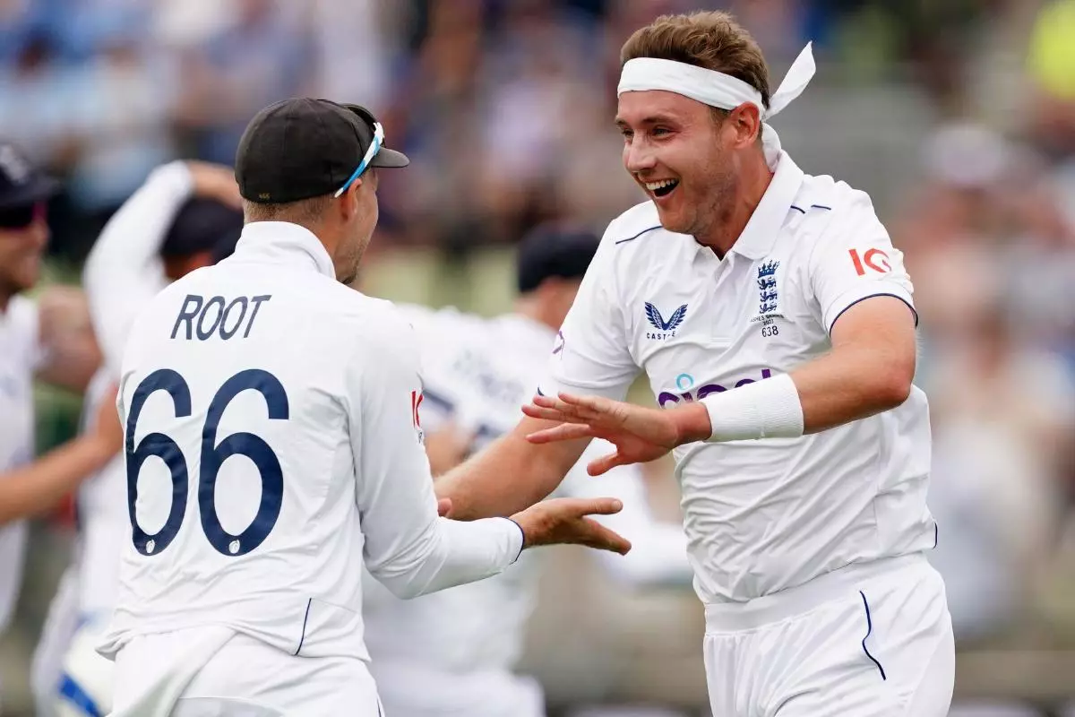 England's Stuart Broad (right) and Joe Root celebrate the wicket of Australia's Marnus Labuschagne