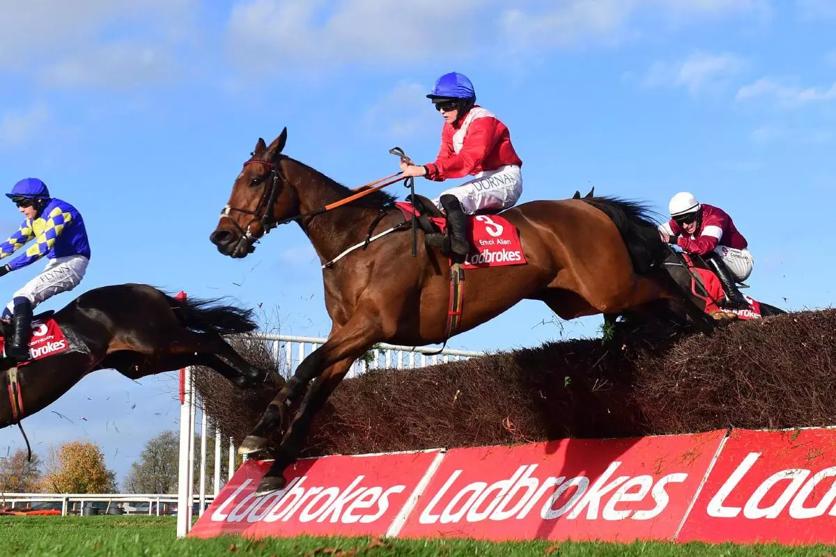 Envoi Allen ridden by jockey Rachael Blackmore jumps the last to win the Ladbrokes Champion Chase