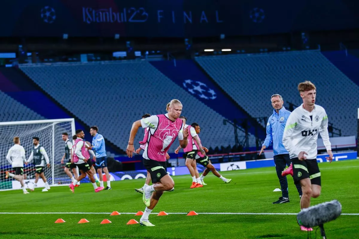 Erling Haaland of Manchester City and teammates warm up during a training session - June 2023