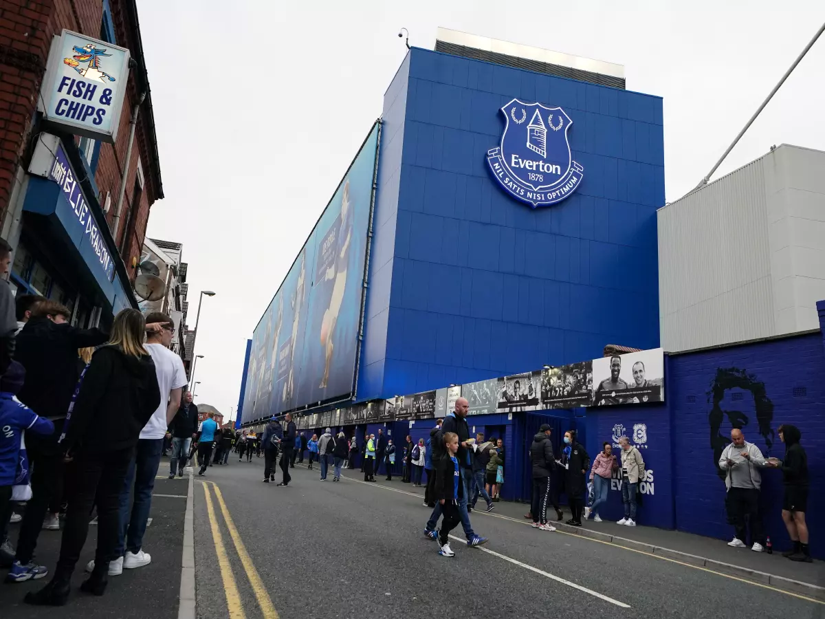 Fans arrive for the Premier League match between Everton and Burnley at Goodison Park, Liverpool.