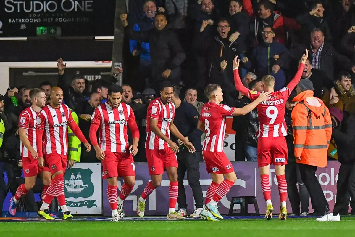 Exeter City forwards Sam Nombe and Jay Stansfield celebrate - May 2023