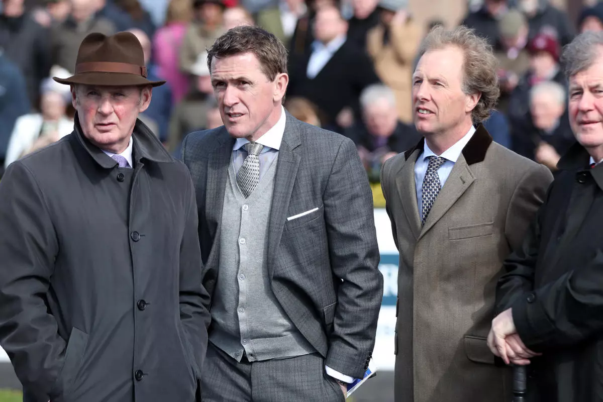 Frank Berry, AP McCoy, Charlie Swan and JP McManus in the parade ring during day two of the Punchestown Festival - March 2023