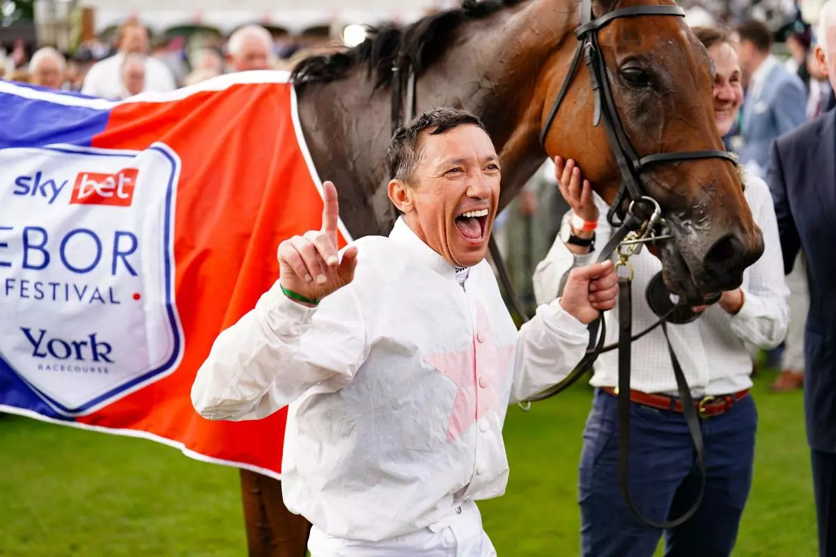 Frankie Dettori celebrates winning the Sky Bet Ebor Handicap on Absurde