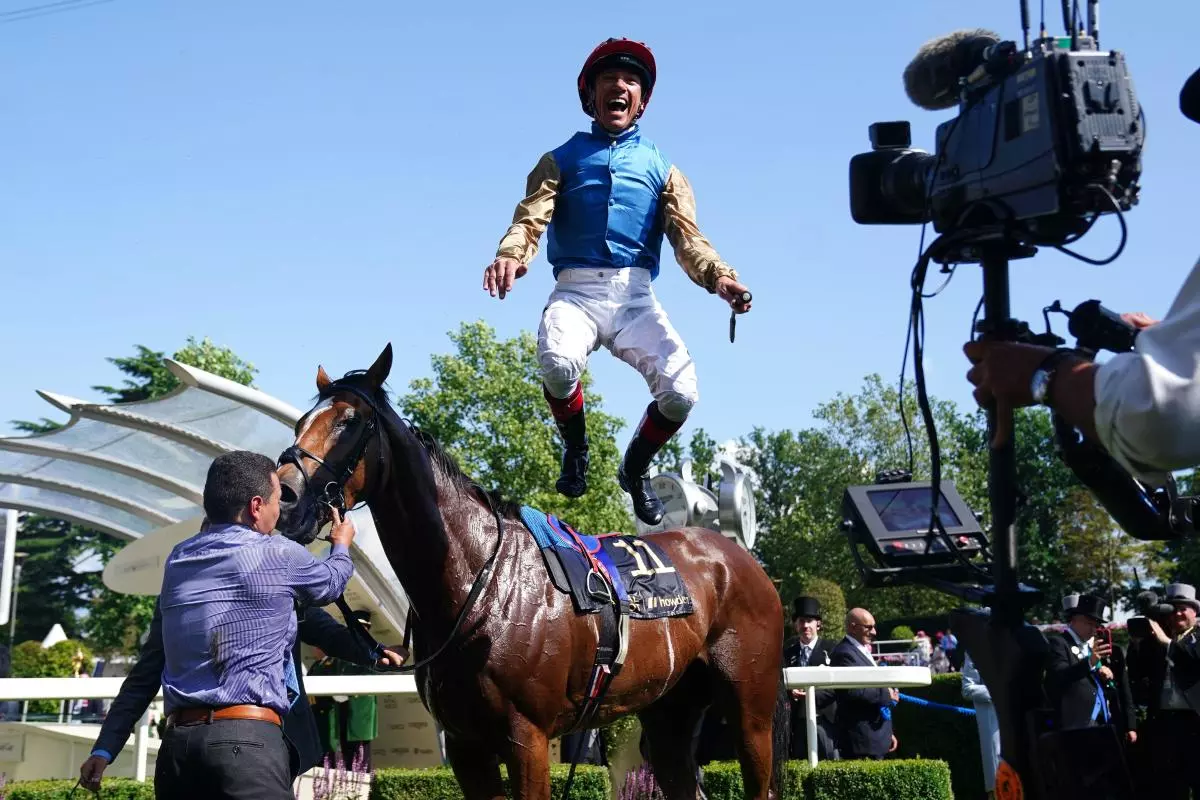 Frankie Dettori celebrates winning the Gold Cup by jumping off Courage Mon Ami