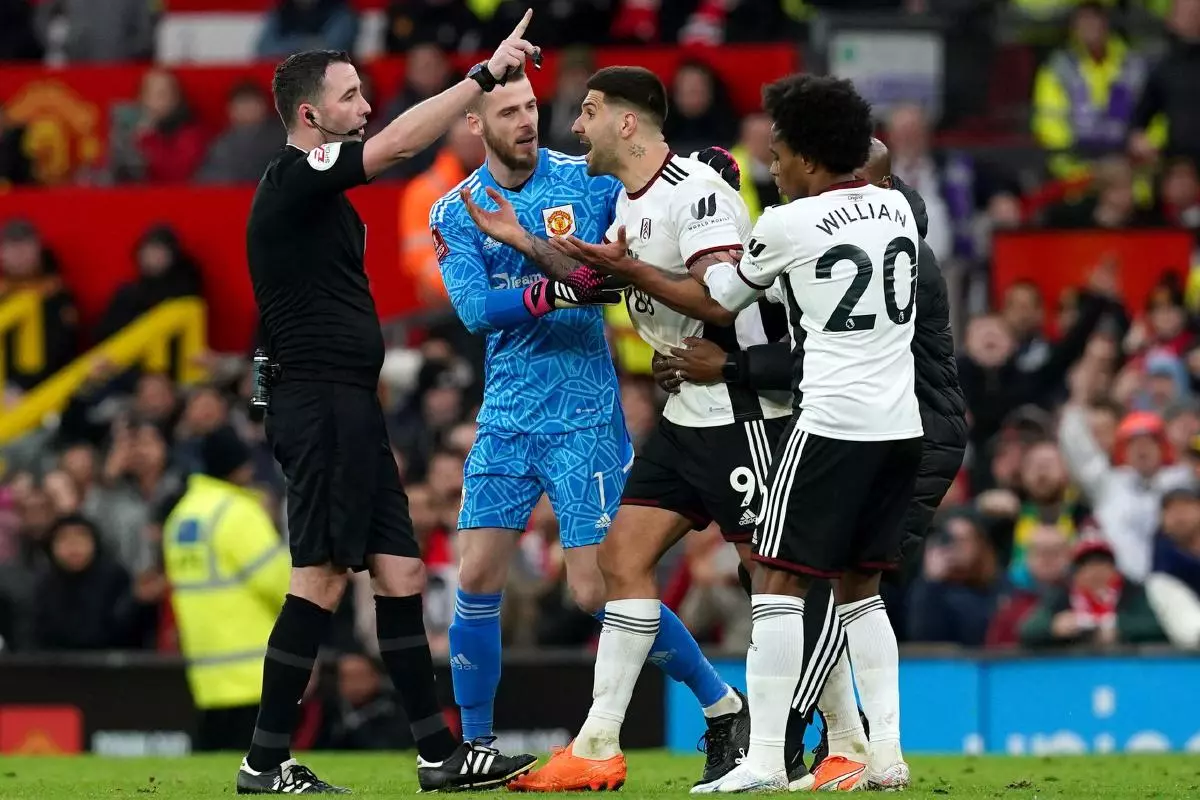 Fulham's Aleksandar Mitrovic (centre) is sent off by referee Chris Kavanagh