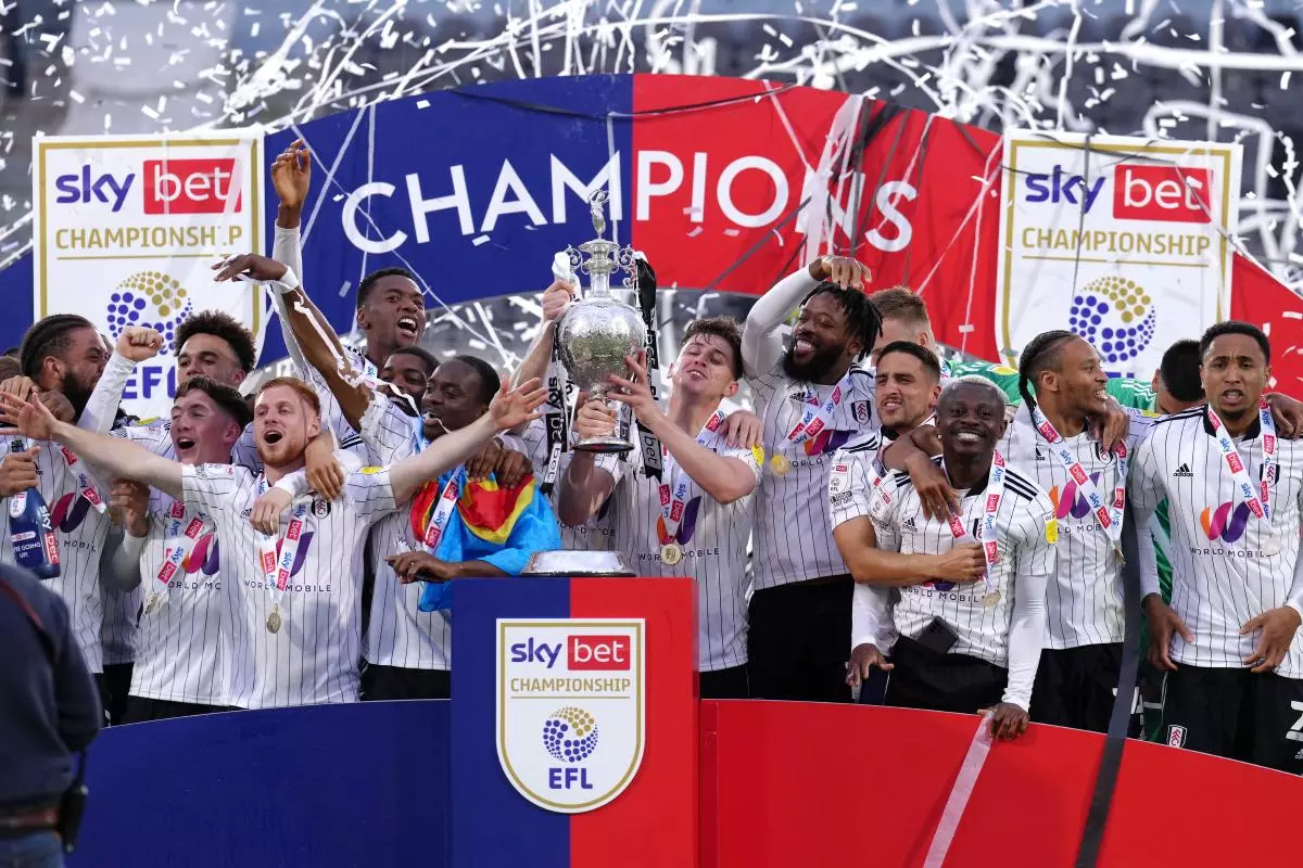 Fulham players celebrate with the Championship trophy after being crowned champions after the Sky Bet Championship match