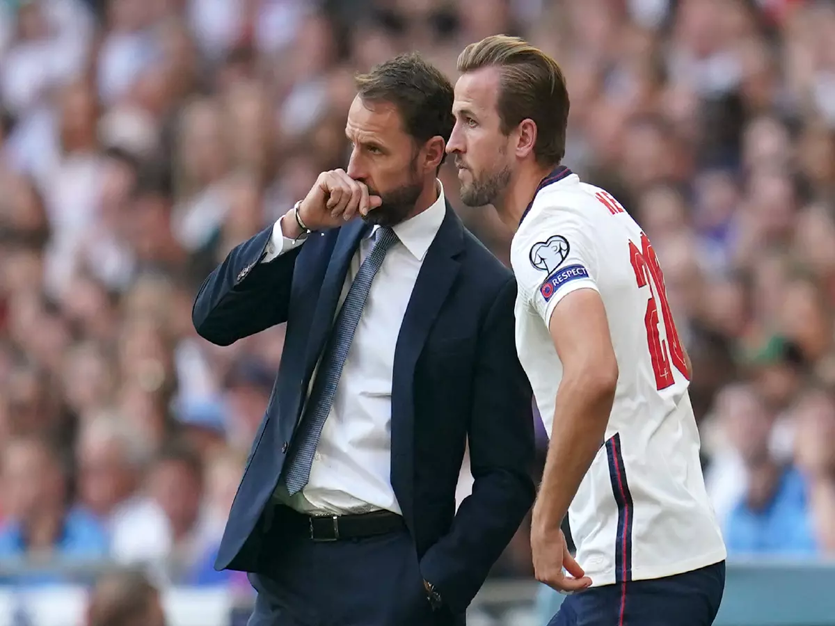 England's Gareth Southgate speaks with substitute Harry Kane on the touchline during the 2022 FIFA World Cup Qualifying match at Wembley Stadium, London
