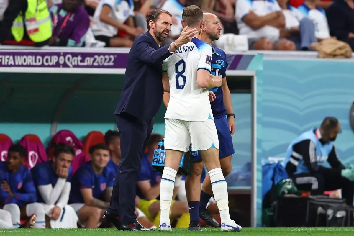 Gareth Southgate manager of England speaks to Jordan Henderson of England