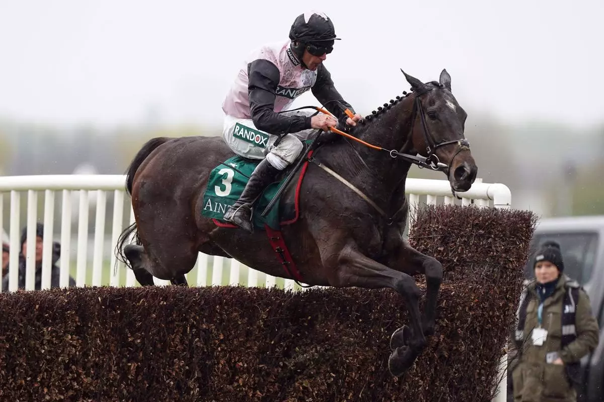 Gerri Colombe ridden by jockey Davy Russell clear a fence on their way to winning the Air Charter Service Mildmay Novices' Chase