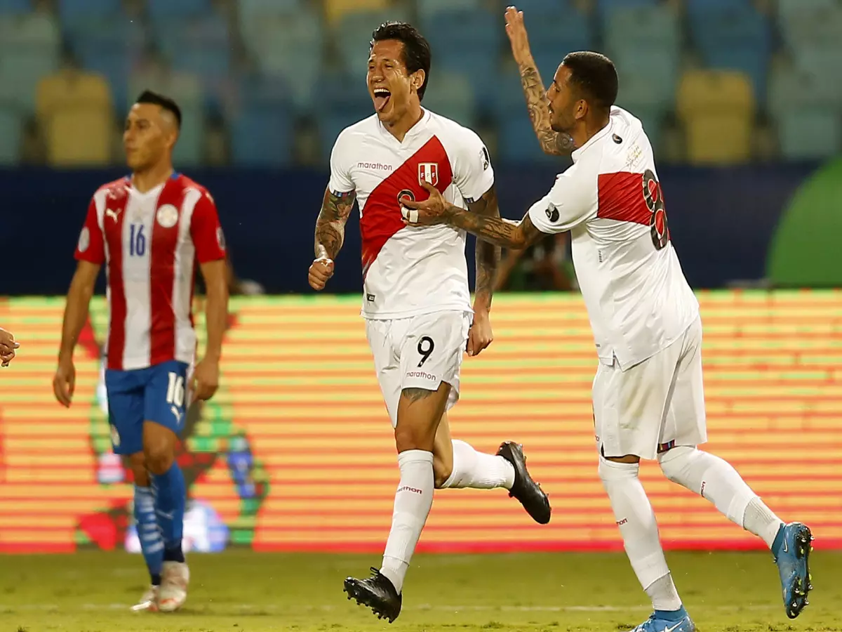 Peru's Gianluca Lapadula (C) celebrates during during the 2021 Copa America Quarterfinals football match between Peru and Paraguay in Goiania, Brazil, on July 2, 2021.