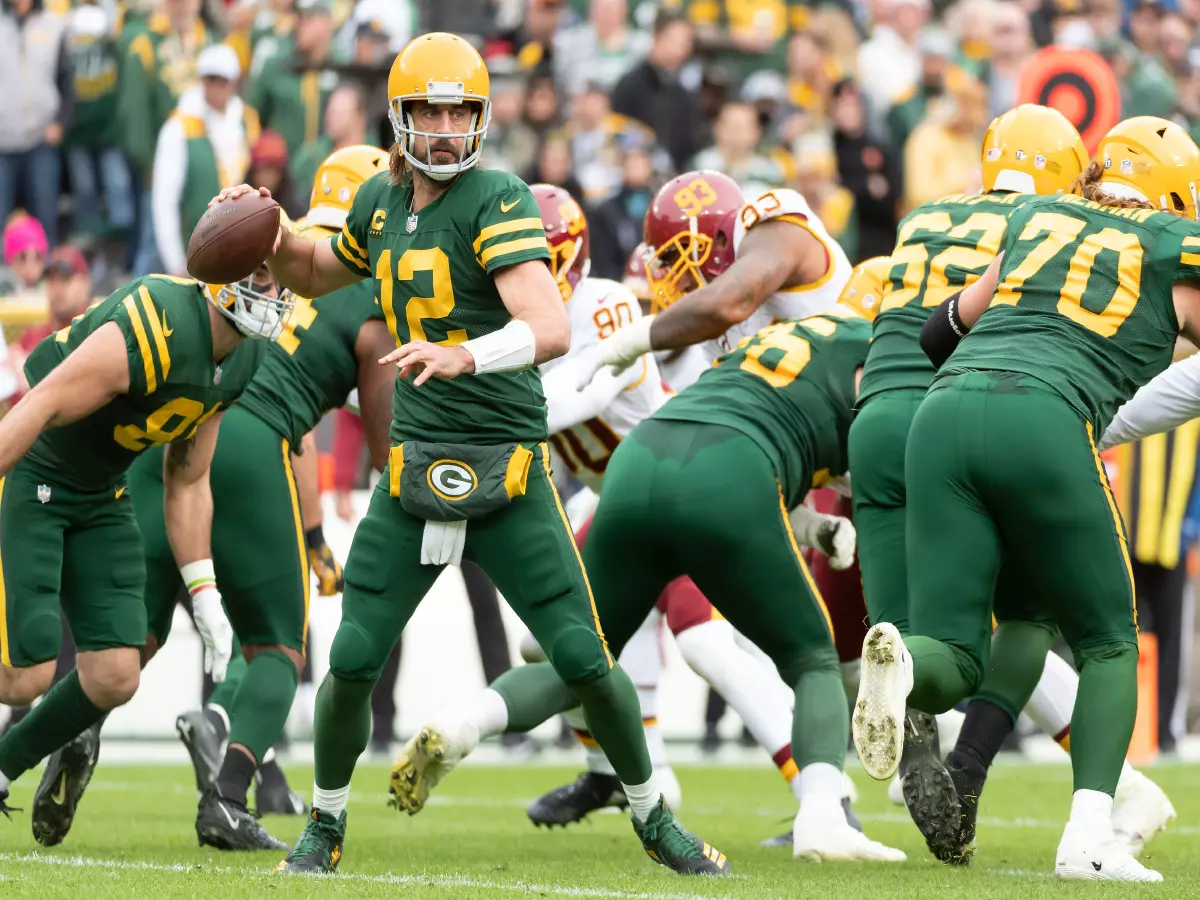 Green Bay Packers quarterback Aaron Rodgers #12 passes the ball during NFL football game between the Washington Football Team and the Green Bay Packers at Lambeau Field in Green Bay, Wisconsi