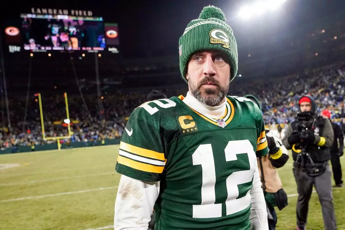 Green Bay Packers' Aaron Rodgers walks off the field