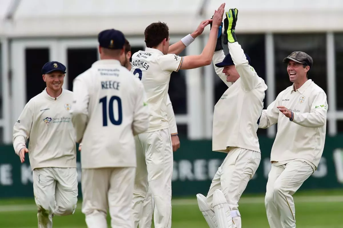 Henry Brookes celebrates with Derbyshire teammates after taking another Leicestershire wicket - May 2023