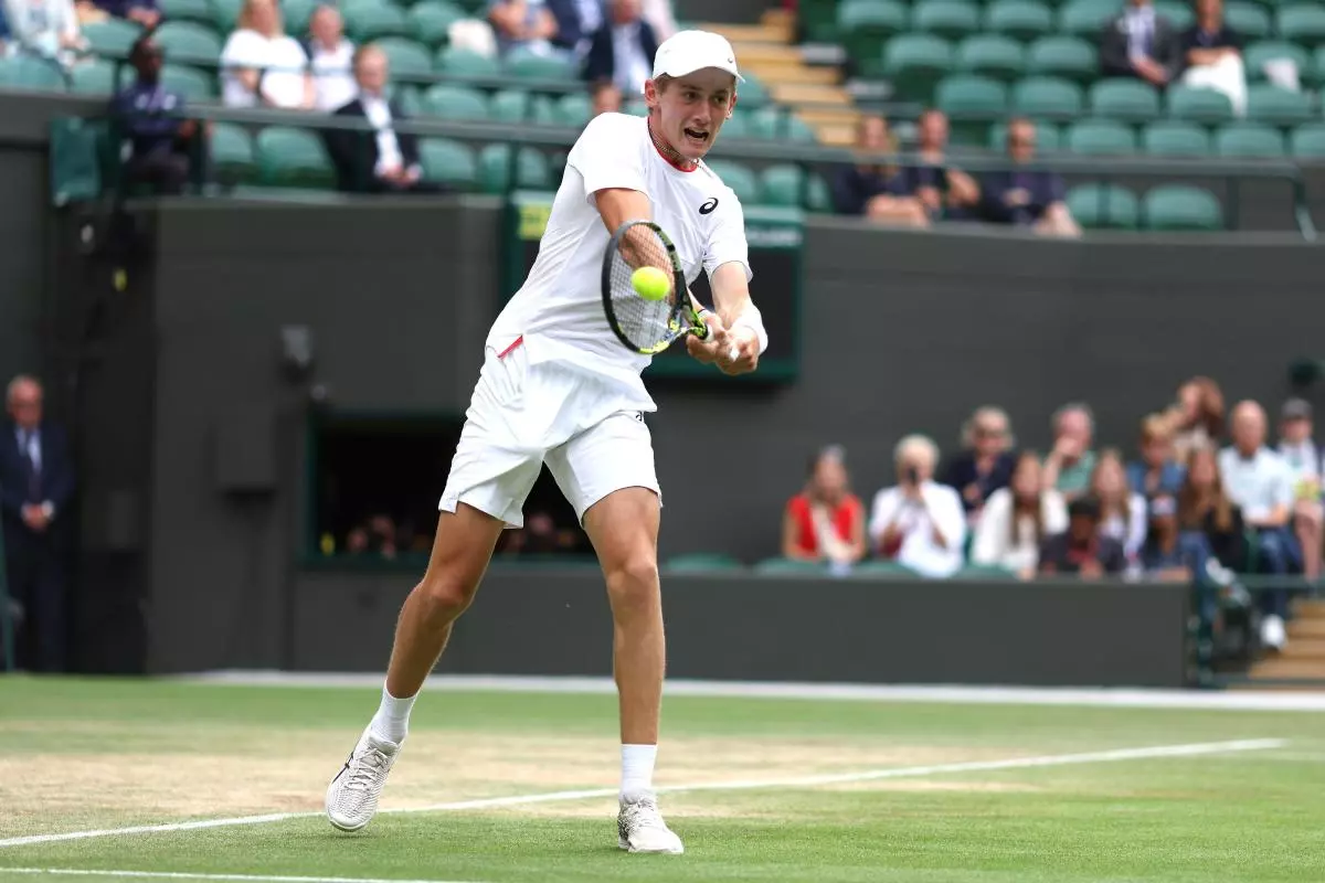 Henry Searle in action against Yaroslav Demin during the Boys' Singles Final at Wimbledon - July 2023