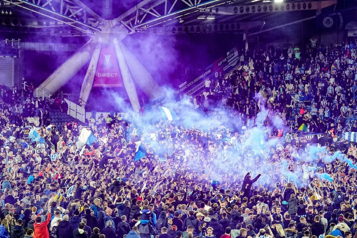 Huddersfield fans invade pitch after play-off win over Luton