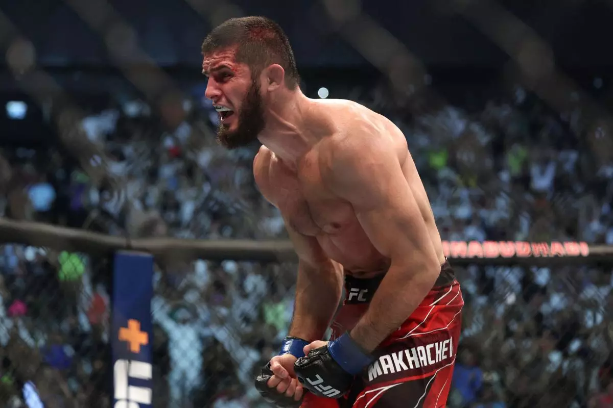 Islam Makhachev celebrates winning his fight