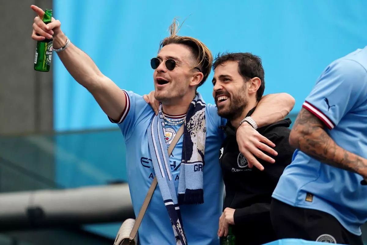 Manchester City's Jack Grealish (left) and Bernardo Silva