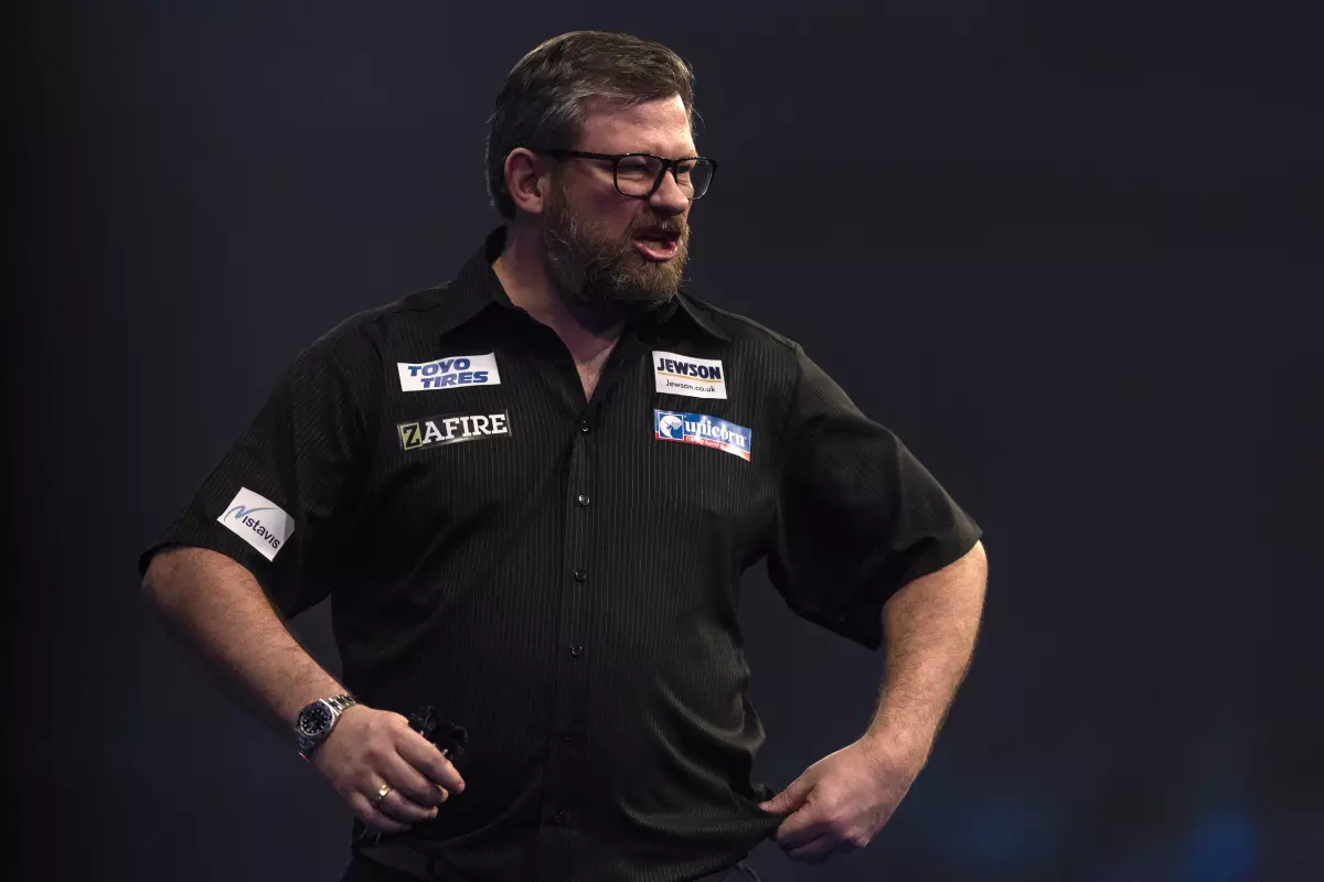 James Wade reacts after winning the 1st set during day fourteen of the William Hill World Darts Championship at Alexandra Palace, London. Picture date: Saturday January 1, 2022.